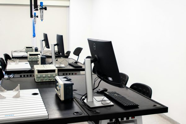 pexels-photo-18471568-18471568 A contemporary electronics lab featuring computers, monitors, and various technical equipment on desks.