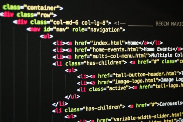 pexels-photo-270404-270404 Close-up of vibrant HTML code displayed on a computer screen, showcasing web development and programming.